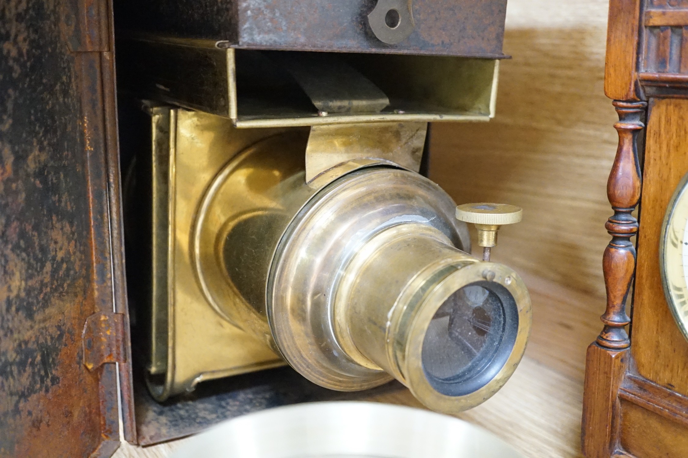 A cased tinplate and pressed brass Magic Lantern, Case 46 cm long, A French walnut cased mantel timepiece, with key, 23cm, and a brass cased Milli-Amps scale